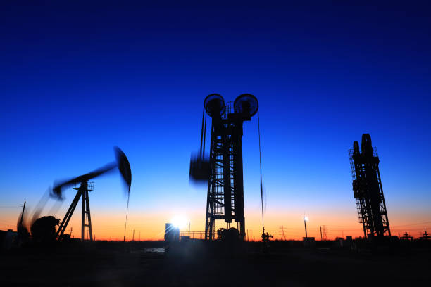 istock The silhouette of tower type pumping unit 892625060