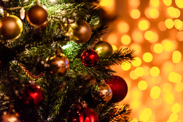 istock Decorated Christmas tree on blurred, sparkling and fairy background 892634596
