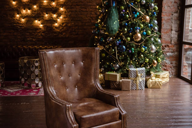 istock Christmas Tree and Christmas gift boxes in the interior with a fireplace. 892634608