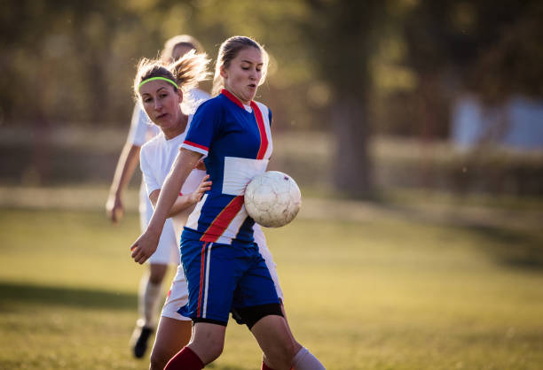 istock Keeping the ball safe on woman's soccer match! 892639092