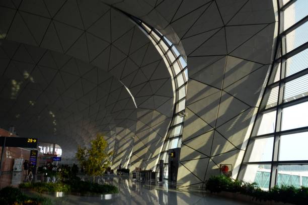 Indoors at Shenyang Taoxian International Airport, Liaoning, China People waiting to flight at the modern Shenyang Taoxian International Airport, Liaoning province, China shenyang stock pictures, royalty-free photos & images