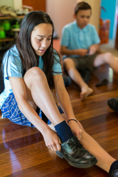 istock School Children Putting Shoes On 892657982