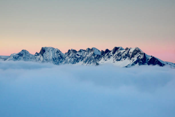 istock winter mountain landscape in a colorful evening sky above the clouds 892658200