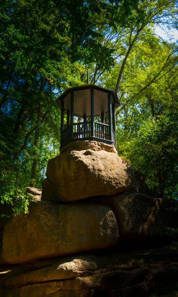 istock beautiful antique gazebo, on a huge boulder in the forest 892663040