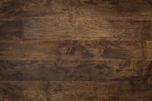 istock Beautiful natural dark brown wood panel texture background 892667690