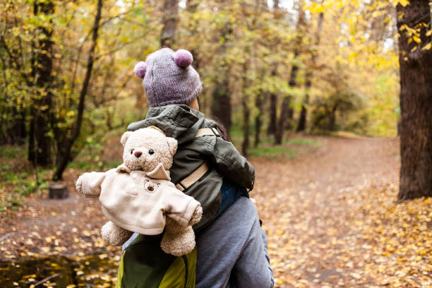 istock Little girl exploring nature with mother. 892668242