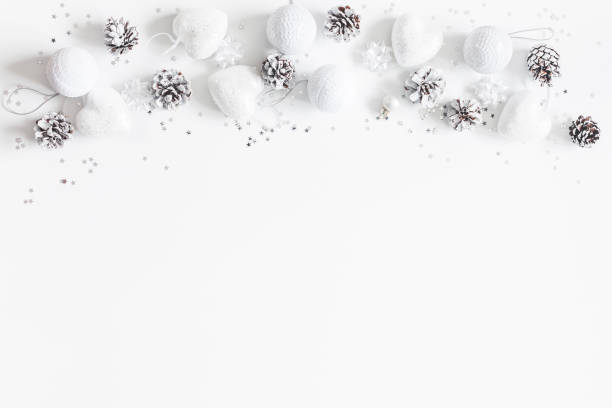 istock Border made of white christmas decorations. Flat lay, top view 892670850
