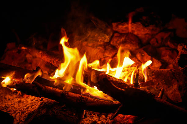 istock Flame on a black background in natural conditions at night. 892670920