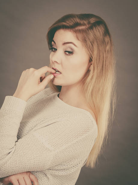 istock Blonde woman contemplating thinking about something 892670992