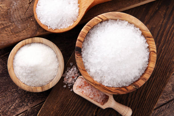 istock differnt kind of sugar in wooden bowl and spoon 892671124