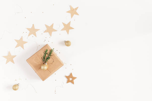 istock Christmas gifts, conifer branches, garland. Flat lay, top view 892671238