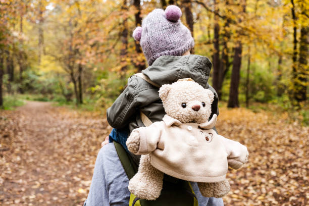 istock Little girl exploring nature with mother. 892671372