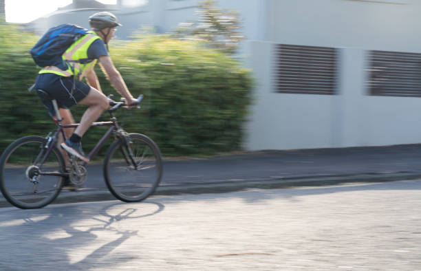 istock Cyclist in suburban street 892674078