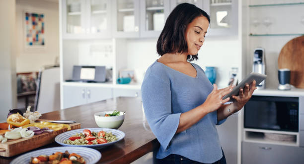istock She's become a master chef thanks to cooking tips online 892674266
