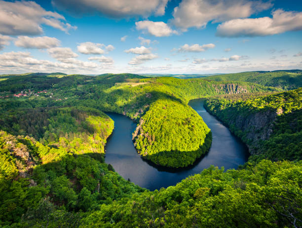 Sunny view of Vltava river horseshoe shape meander from Maj viewpoint. Sunny view of Vltava river horseshoe shape meander from Maj viewpoint. Colorful spring scene in Czech Republic. Artistic style post processed photo. horseshoe canyon stock pictures, royalty-free photos & images