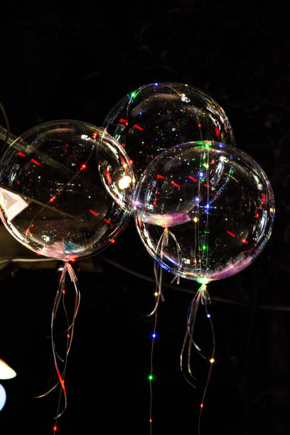 istock big beautiful gel balloons, painted lights and light bulbs. at night 892678754