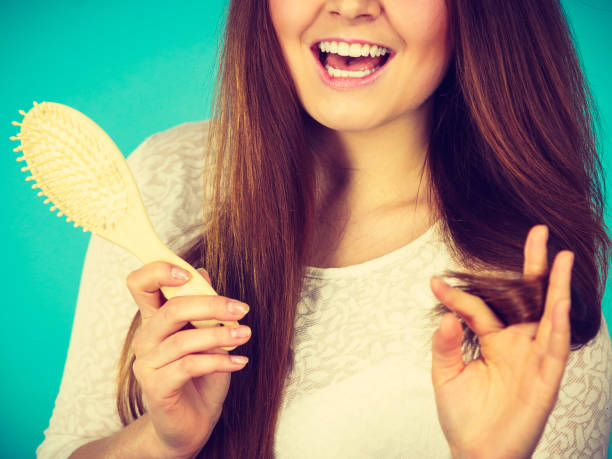 istock Happy woman brushing her hair 892679974