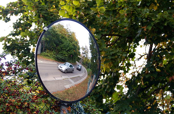 Defensive Driving Mirror on Hidden Corner in Europe stock photo
