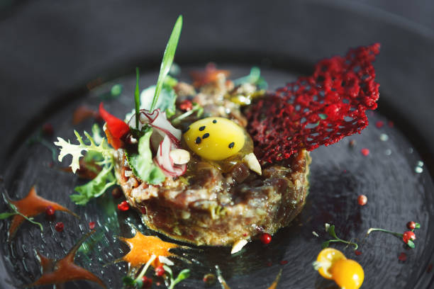 istock Modern restaurant dish. Veal tartare with quail egg closeup 892694090