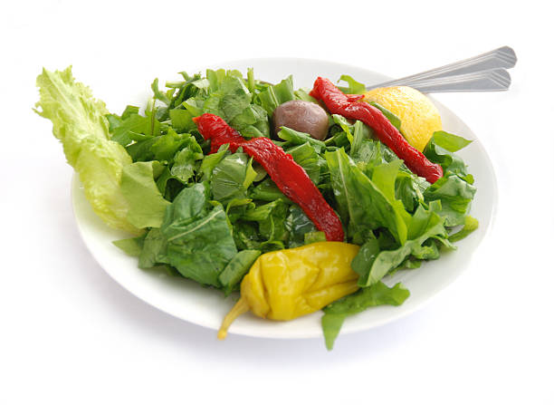 Green salad on white with soft shadow stock photo