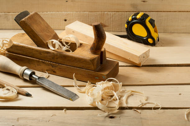 istock Carpentry concept.Joiner carpenter workplace. Construction tools on wooden table with sawdust. 892701306