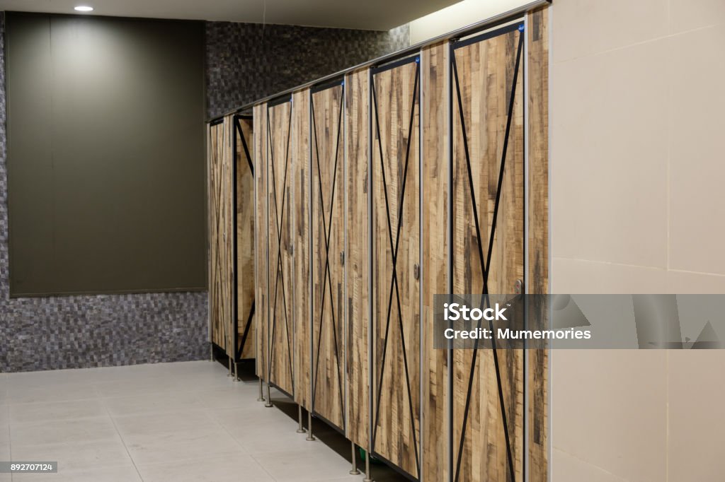 Public toilet interior decorative wooden doors Public toilet interior decorative wooden doors closed Decorating Stock Photo