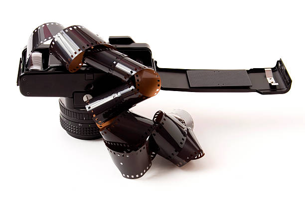 istock Retro SLR camera with film spilling from the back 89270728