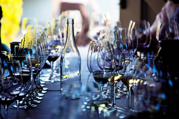 Empty wine glasses and water bottle on a table after wine tasting