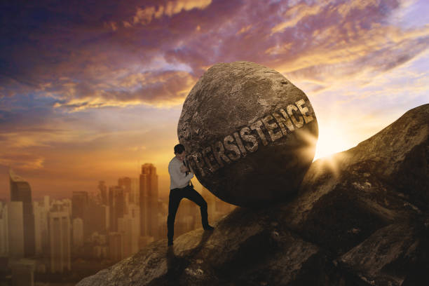 istock American businessman pushing persistence word 892717038