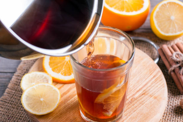 istock Preparation of mulled wine with orange and spices 892717560