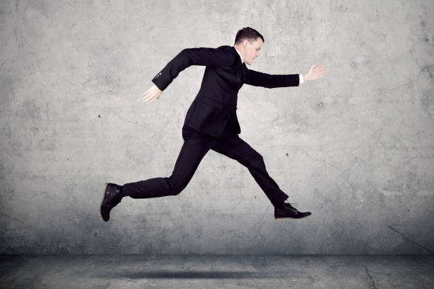 istock Young businessman running with fast motion 892725690