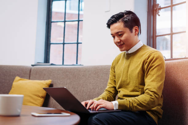 istock Taiwanese businessman working on laptop in modern office 892726360