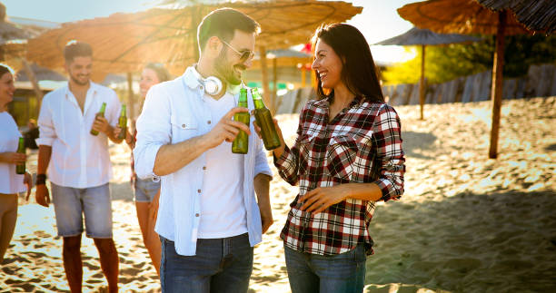 istock Friends partying and having fun on beach at summer 892735868