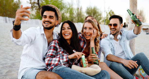 istock Friends partying and having fun on beach at summer 892736268