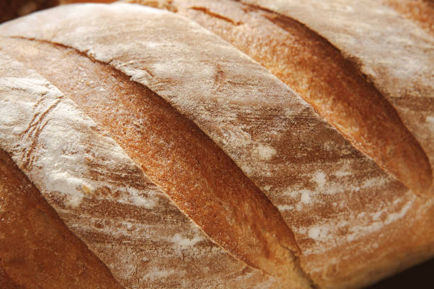 istock Bread texture background, closeup of baguette loaf 892739324