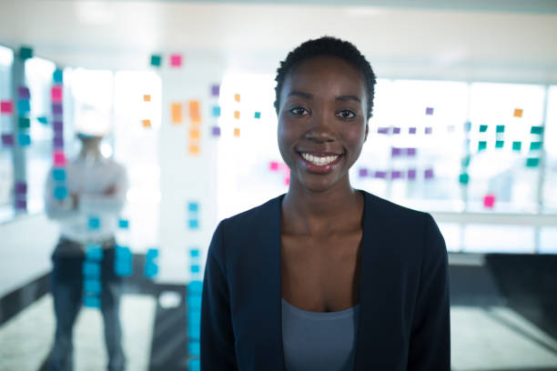 istock Female executive standing in office 892739776