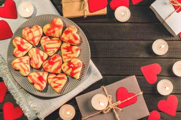 istock cookie-hearts, paper hearts, candles, boxes with presents, congratulation with Valentine's day 892748352