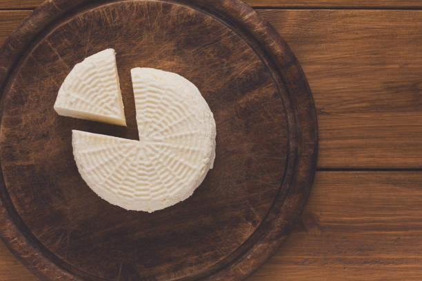 istock Cheese wheel, homemade indian paneer top view 892749490
