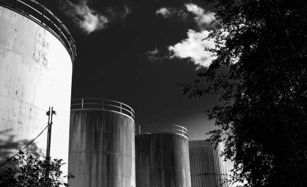 istock derelict industrial tanks overgrown with weeds and rusty 892751636