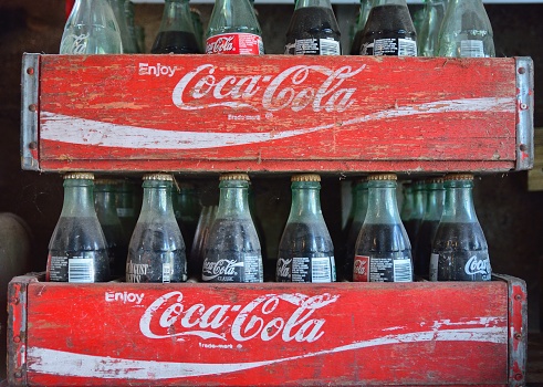 Missouri, Usa - July 19, 2017: Two old wooden boxes with coca cola bottles. Coca-Cola is a carbonated soft drink produced by The Coca-Cola Company.