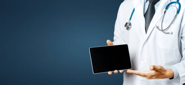 istock Doctor uses digital tablet On blue background 892779286