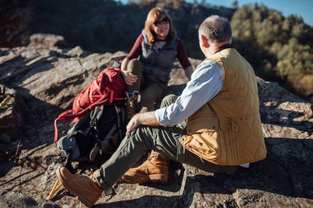 istock Senior couple taking break from hiking 892787038