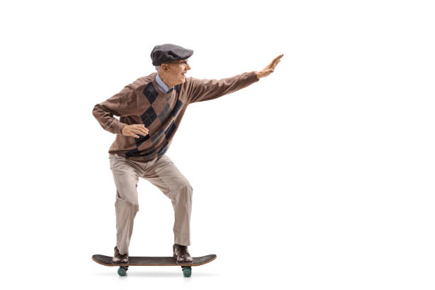 istock Elderly man riding a skateboard 892797084