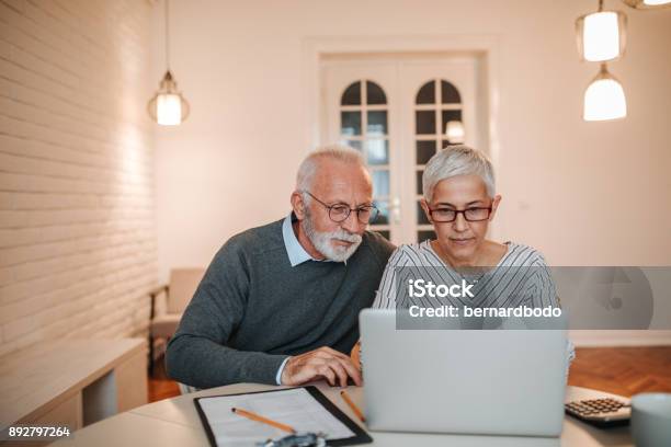 Time To Go Over The Budget Stock Photo - Download Image Now - Senior Couple, Retirement, Senior Adult