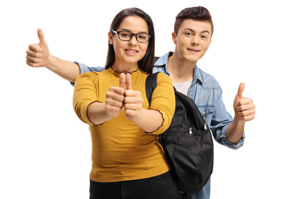 istock Teenage students making thumb up gestures 892797638