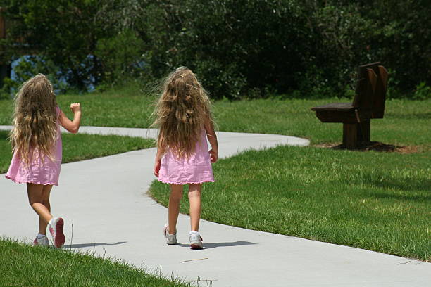 istock Young girls walking in the park 89279793