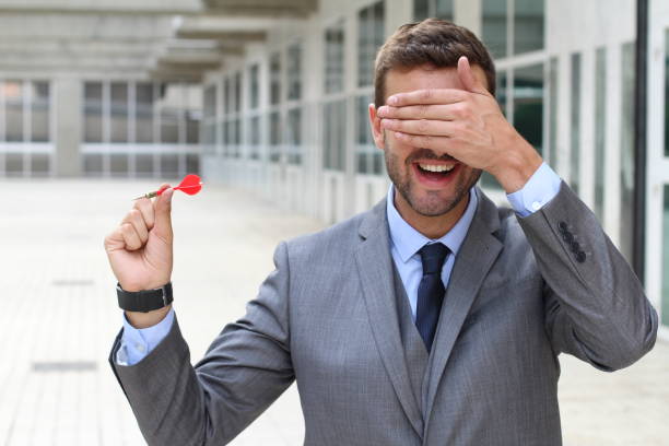 istock Blind businessman holding a dart 892801466