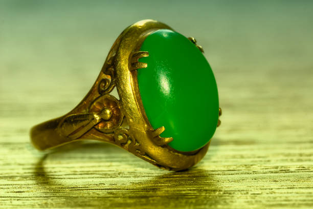 istock Green jade and gold ring 892807260