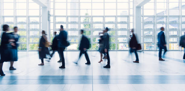 istock blurred people walking in Frankfurt building 892807522