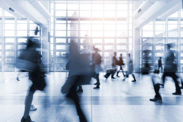 istock blurred people walking in Frankfurt building 892807524